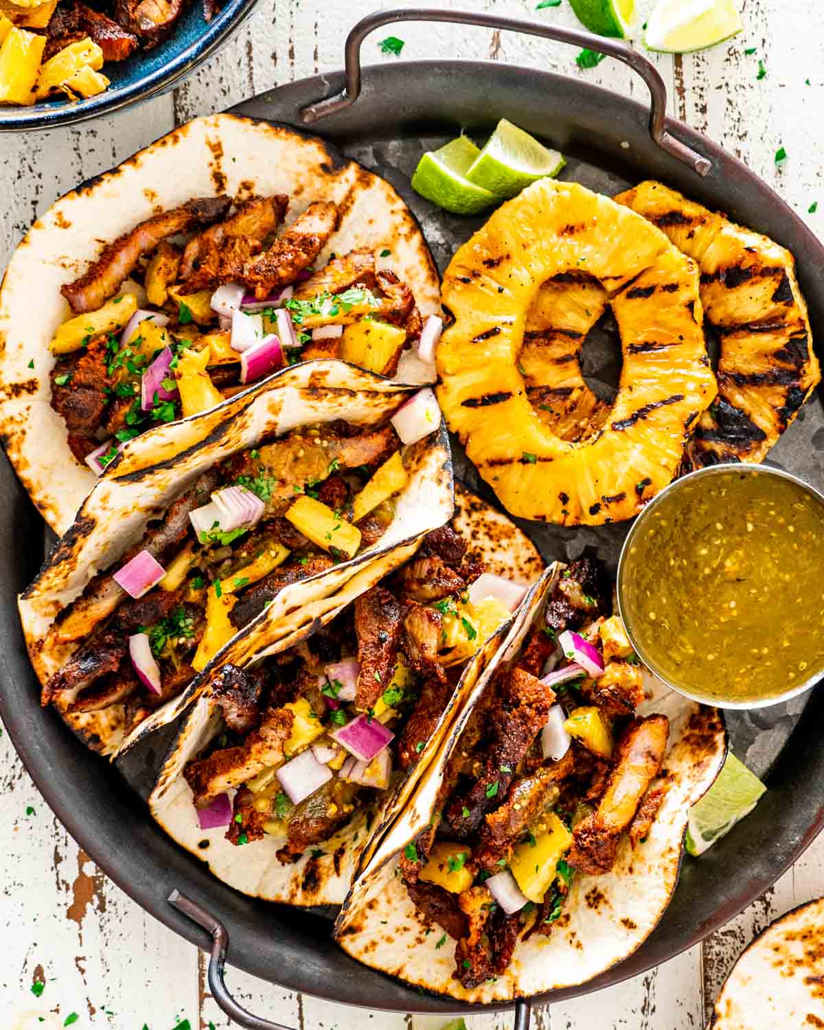 Tacos al pastor with pineapple and cilantro